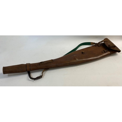 478 - A LEATHER LEG O MUTTON GUN CASE. A brown leather gun case with twin strap fastening and carrying str... 