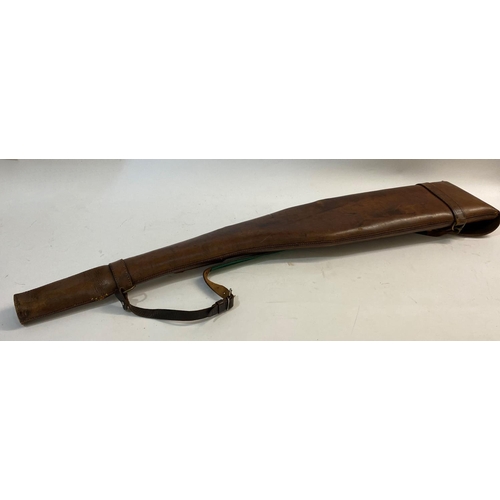 478 - A LEATHER LEG O MUTTON GUN CASE. A brown leather gun case with twin strap fastening and carrying str... 