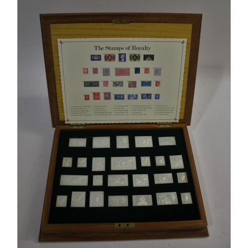 1438 - CASED SILVER STAMPS - THE STAMPS OF ROYALTY 25 silver replicas of British stamps, with a card index ... 