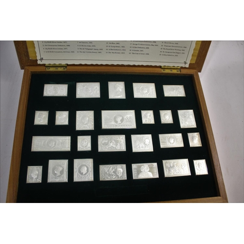 1438 - CASED SILVER STAMPS - THE STAMPS OF ROYALTY 25 silver replicas of British stamps, with a card index ... 