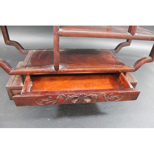 1004 - CHINESE HARDWOOD DISPLAY STAND possibly for snuff bottles, a hardwood display stand with shelves on ... 