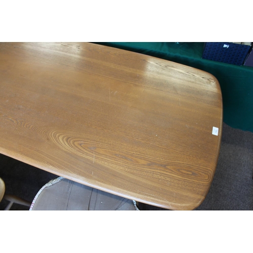 702 - ERCOL DINING TABLE & CHAIRS a light elm and beech dining table with splayed legs (151cms long), also... 