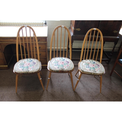 702 - ERCOL DINING TABLE & CHAIRS a light elm and beech dining table with splayed legs (151cms long), also... 