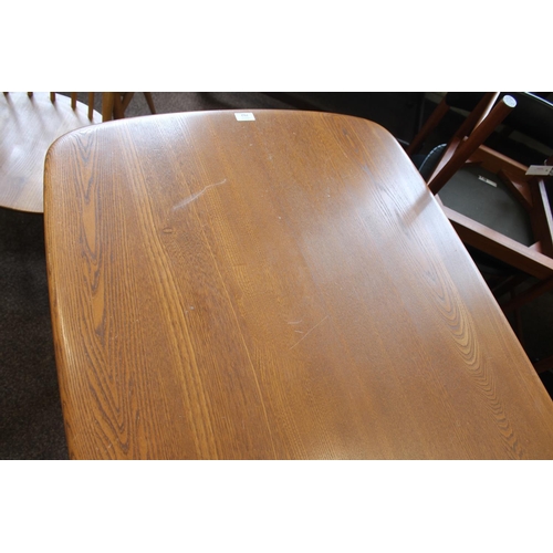 702 - ERCOL DINING TABLE & CHAIRS a light elm and beech dining table with splayed legs (151cms long), also... 