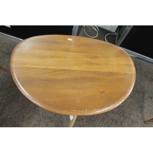 704 - ERCOL NEST OF TABLES - PEBBLE TABLES a set of three light elm and beech pebble coffee tables, one wi... 