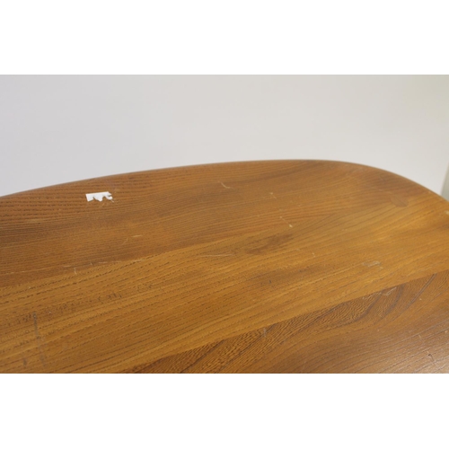 704 - ERCOL NEST OF TABLES - PEBBLE TABLES a set of three light elm and beech pebble coffee tables, one wi... 