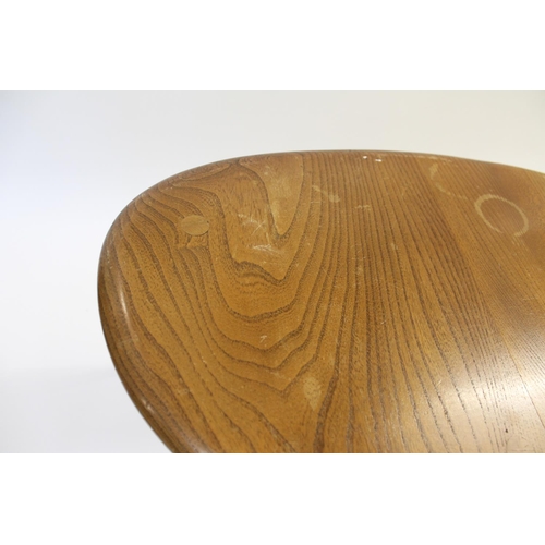 704 - ERCOL NEST OF TABLES - PEBBLE TABLES a set of three light elm and beech pebble coffee tables, one wi... 