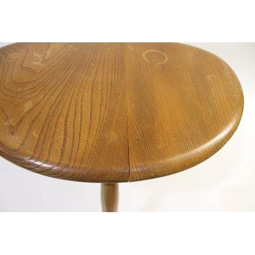 704 - ERCOL NEST OF TABLES - PEBBLE TABLES a set of three light elm and beech pebble coffee tables, one wi... 