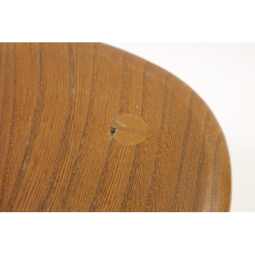 704 - ERCOL NEST OF TABLES - PEBBLE TABLES a set of three light elm and beech pebble coffee tables, one wi... 