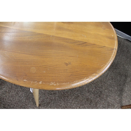 704 - ERCOL NEST OF TABLES - PEBBLE TABLES a set of three light elm and beech pebble coffee tables, one wi... 