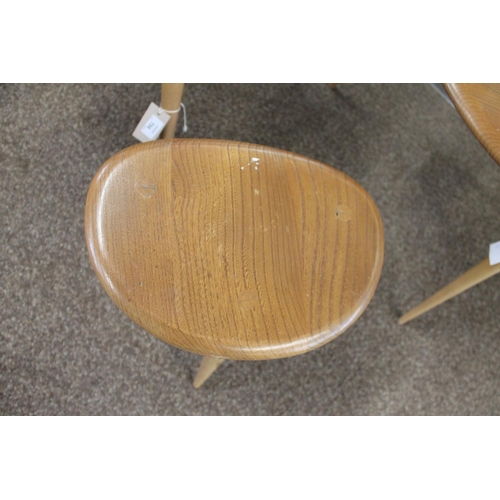 704 - ERCOL NEST OF TABLES - PEBBLE TABLES a set of three light elm and beech pebble coffee tables, one wi... 