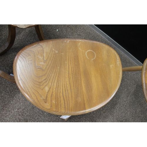 704 - ERCOL NEST OF TABLES - PEBBLE TABLES a set of three light elm and beech pebble coffee tables, one wi... 