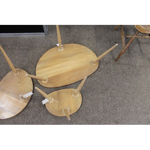 704 - ERCOL NEST OF TABLES - PEBBLE TABLES a set of three light elm and beech pebble coffee tables, one wi... 