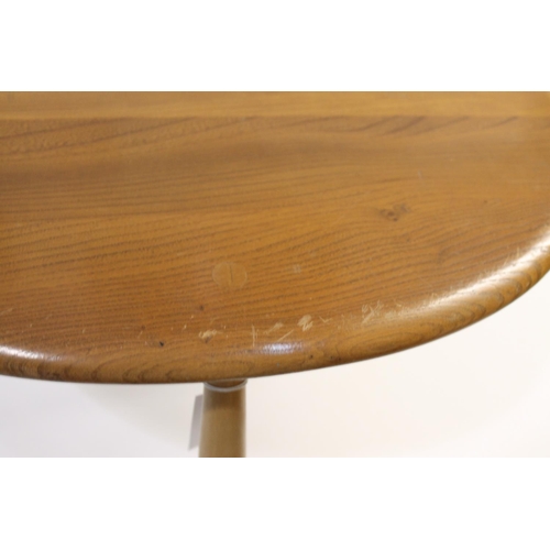 704 - ERCOL NEST OF TABLES - PEBBLE TABLES a set of three light elm and beech pebble coffee tables, one wi... 