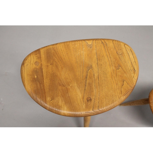 705 - ERCOL 'PEBBLE' TABLES 2 light elm and beech graduated side tables, unmarked. 48cms and 33cms across.... 