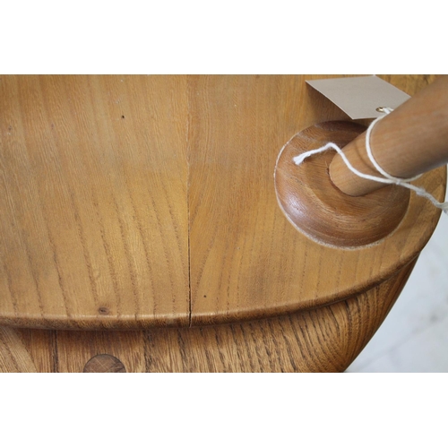 705 - ERCOL 'PEBBLE' TABLES 2 light elm and beech graduated side tables, unmarked. 48cms and 33cms across.... 