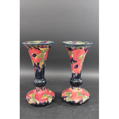 722 - PAIR OF WILLIAM MOORCROFT VASES - POMEGRANATE a large pair of vases with a trumpet shaped neck, in t... 