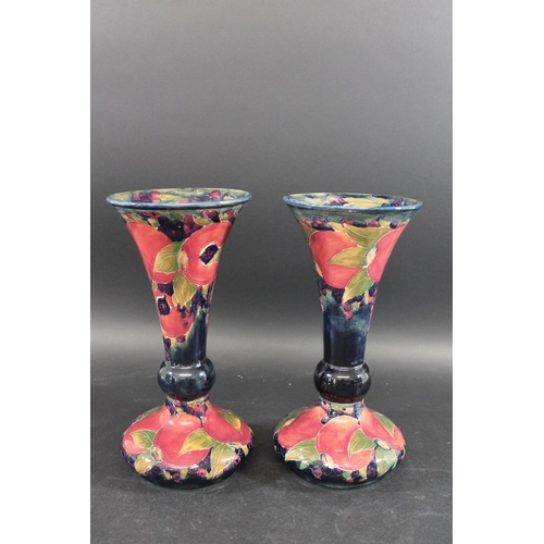 722 - PAIR OF WILLIAM MOORCROFT VASES - POMEGRANATE a large pair of vases with a trumpet shaped neck, in t... 