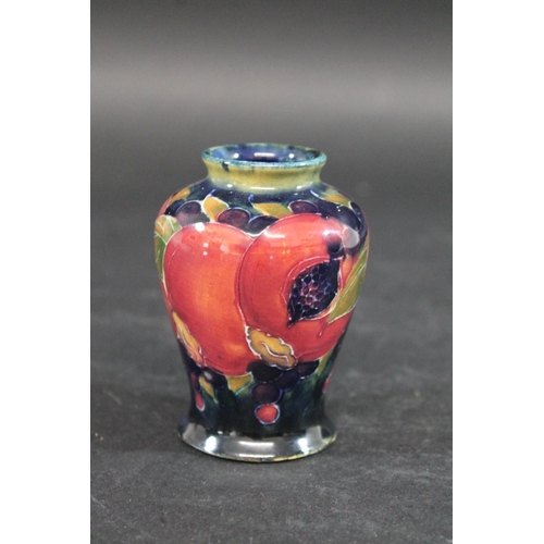 725 - MINIATURE MOORCROFT VASE - POMEGRANATE a miniature vase painted in the Pomegranate design on a blue ... 