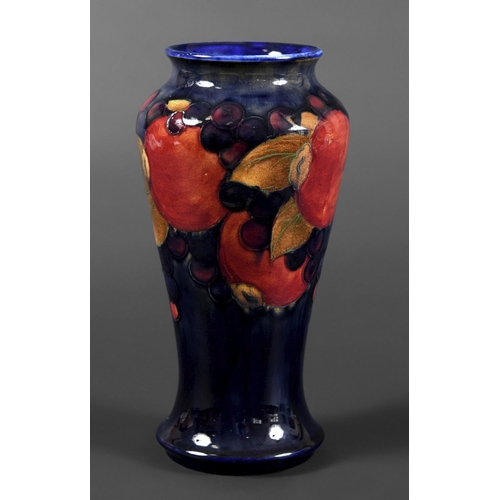 726 - MOORCROFT VASE - POMEGRANATE a William Moorcroft vase, the tall slender vase in the Pomegranate desi... 