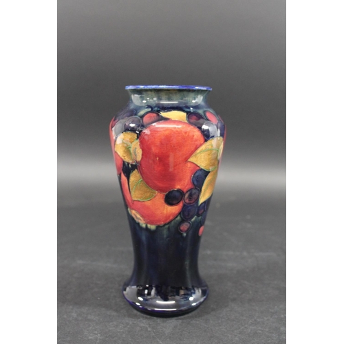 726 - MOORCROFT VASE - POMEGRANATE a William Moorcroft vase, the tall slender vase in the Pomegranate desi... 