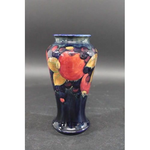 726 - MOORCROFT VASE - POMEGRANATE a William Moorcroft vase, the tall slender vase in the Pomegranate desi... 