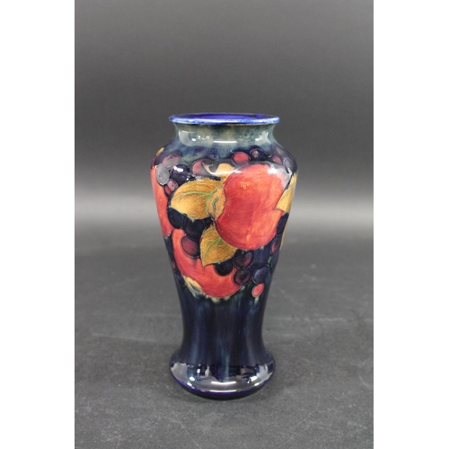 726 - MOORCROFT VASE - POMEGRANATE a William Moorcroft vase, the tall slender vase in the Pomegranate desi... 