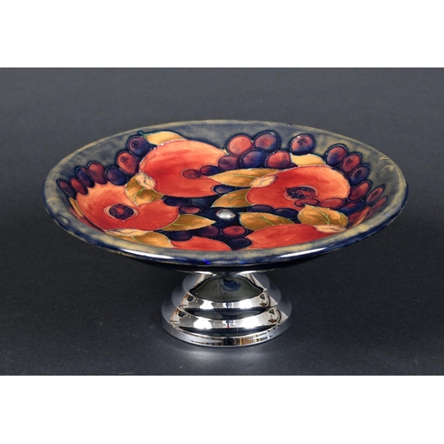 727 - MOORCROFT TAZZA - POMEGRANATE a William Moorcroft tazza, in the Pomegranate design on a blue ground ... 