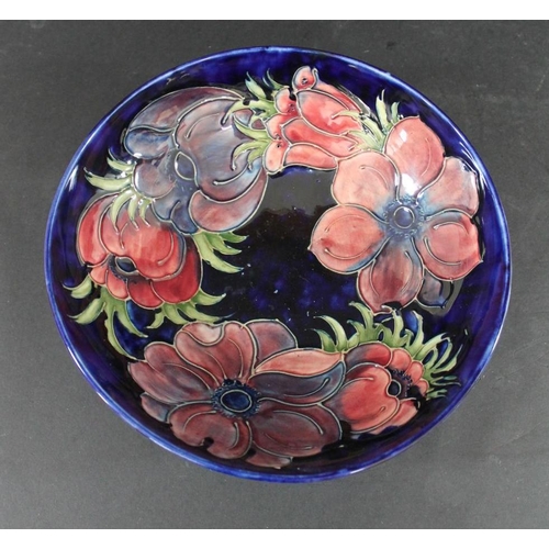 731 - LARGE MOORCROFT BOWL - 1983 a large bowl in the Anemone design on a blue ground, marked to the rever... 