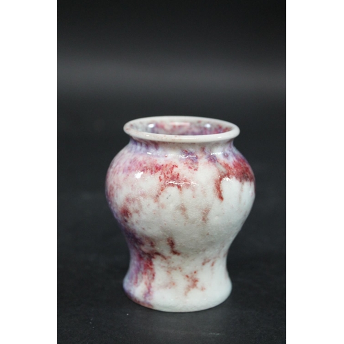 734 - RUSKIN MINIATURE HIGH FIRED VASE a squat miniature vase with a high fired glaze, small firing crack ... 