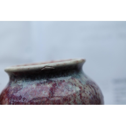 734 - RUSKIN MINIATURE HIGH FIRED VASE a squat miniature vase with a high fired glaze, small firing crack ... 