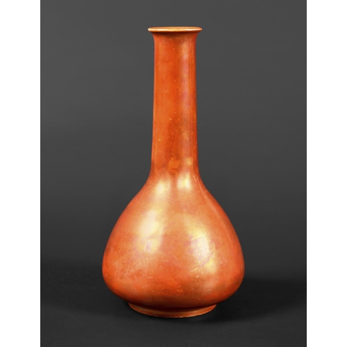 735 - RUSKIN VASE  the vase with a narrow tapering neck and bulbous body, and with a orange lustre glaze. ... 