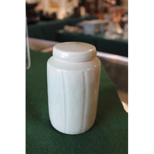 749 - DAVID LEACH (1911-2005) - PORCELAIN LIDDED JAR a cylindrical fluted lidded jar, with incised vertica... 