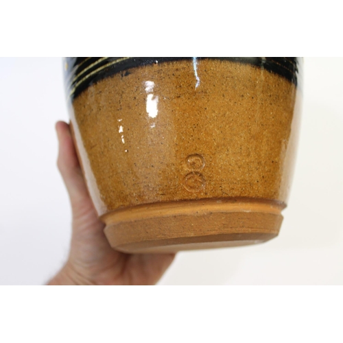 751 - ABUJA STUDIO POTTERY JUG with a tenmoku glaze and line decoration, seal mark to base of handle (diff... 