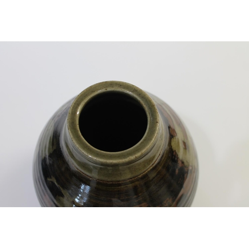 751 - ABUJA STUDIO POTTERY JUG with a tenmoku glaze and line decoration, seal mark to base of handle (diff... 