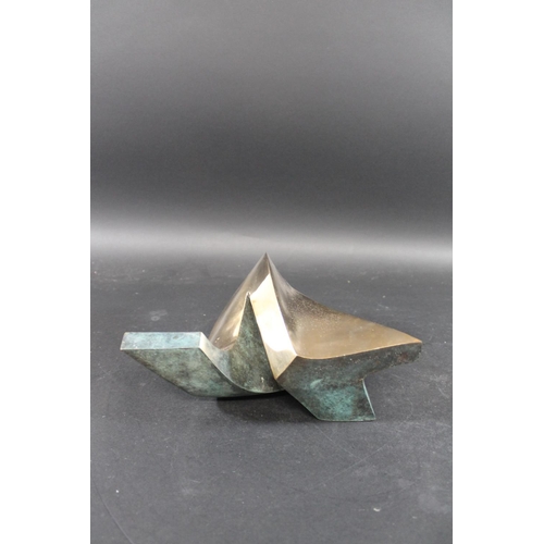 760 - ABSTRACT BRONZE SCULPTURE a polished bronze abstract sculpture of curving shape, with a verdigris lo... 