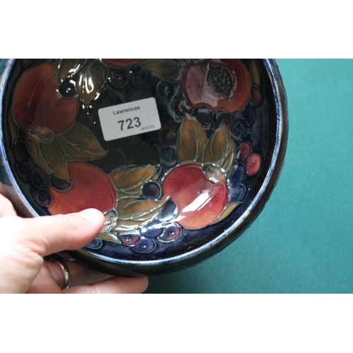 723 - WILLIAM MOORCROFT BOWL in the Pomegranate design on a blue ground. Painted signature and impressed m... 