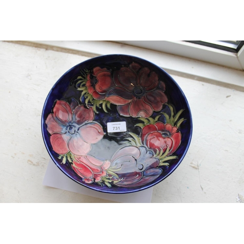 731 - LARGE MOORCROFT BOWL - 1983 a large bowl in the Anemone design on a blue ground, marked to the rever... 