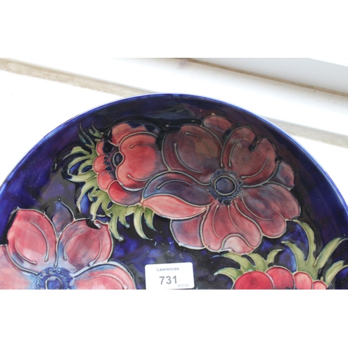 731 - LARGE MOORCROFT BOWL - 1983 a large bowl in the Anemone design on a blue ground, marked to the rever... 