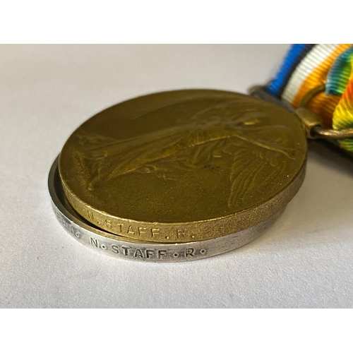 214 - A FIRST WORLD WAR PAIR TO THE NORTH STAFFORDSHIRE REGIMENT. A Great War pair comprising War Medal an... 