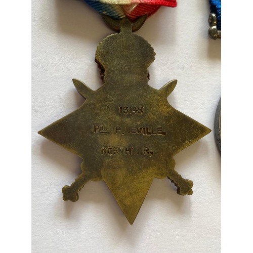 296 - A FIRST WORLD WAR TRIO AND MEMORIAL PLAQUE TO THE NORTHAMPTONSHIRE REGIMENT. A Great War Trio compri... 