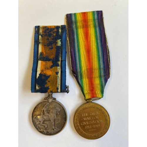 299 - A FIRST WORLD WAR PAIR AND MEMORIAL PLAQUE TO THE MANCHESTER REGIMENT. A Great War pair comprising W... 