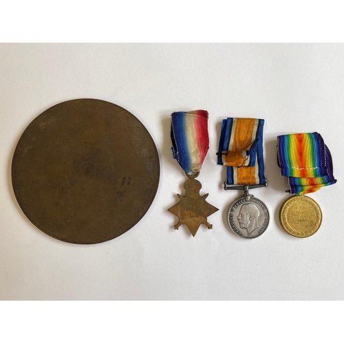 325 - A FIRST WORLD WAR PLAQUE AND TRIO TO THE SERVICE CORPS. A Great War Trio comprising 1914-15 Star nam... 