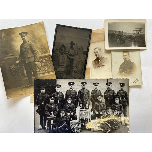 409 - AN APPARENT FAMILY GROUP OF FIRST AND SECOND WORLD WAR MEDALS. A framed collection of medals, badges... 