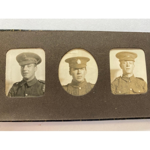 409 - AN APPARENT FAMILY GROUP OF FIRST AND SECOND WORLD WAR MEDALS. A framed collection of medals, badges... 