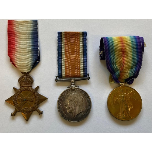 412 - A FIRST WORLD WAR TRIO AND MEMORIAL PLAQUE TO A CASUALTY AT THE BATTLE OF LOOS. A Great War Trio com... 