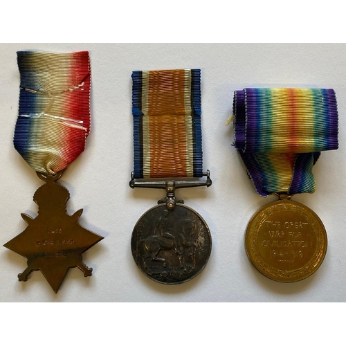 412 - A FIRST WORLD WAR TRIO AND MEMORIAL PLAQUE TO A CASUALTY AT THE BATTLE OF LOOS. A Great War Trio com... 