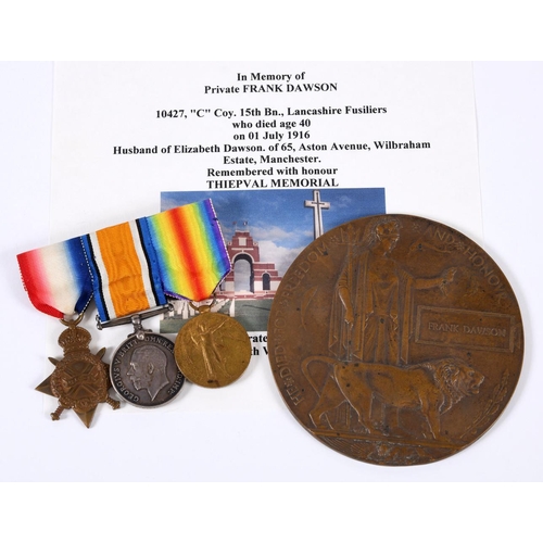 582 - A FIRST WORLD WAR TRIO AND PLAQUE TO A PRIVATE IN THE SALFORD PALS WHO WAS KILLED ON THE FIRST DAY O... 