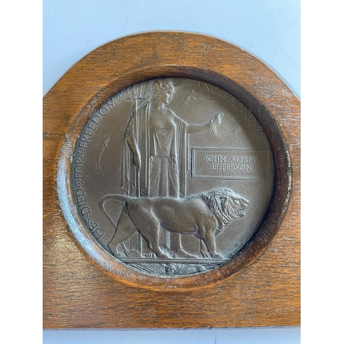 583 - A FIRST WORLD WAR PAIR, SCROLL AND FRAMED PLAQUE TO A CASUALTY FROM THE YORK REGIMENT WHO WAS KILLED... 