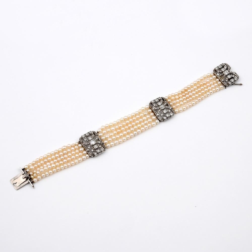 1180 - A CULTURED PEARL & DIAMOND BRACELET. formed as five rows of cultured pearls, with three rectangular-... 